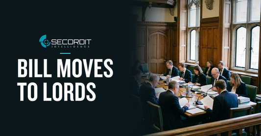Secordit Intelligence logo and the headline “BILL MOVES TO LORDS” on a dark panel fading into a photo of a parliamentary committee room in session.