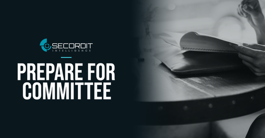 Secordit Intelligence logo and the headline “PREPARE FOR COMMITTEE” on a dark panel fading into a photo of a black-and-white close-up of a meeting table.
